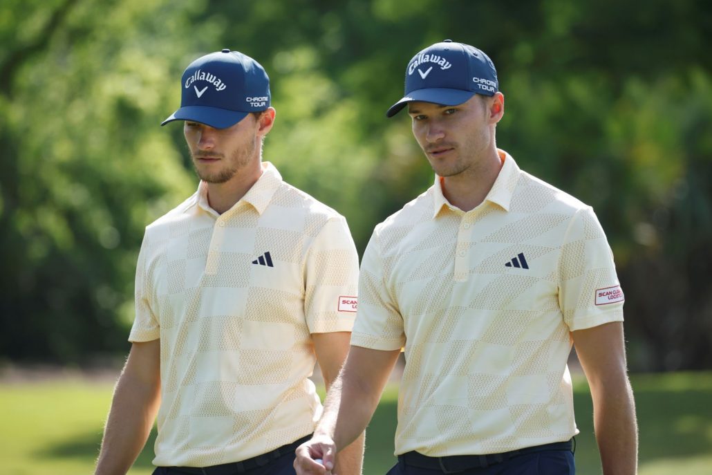 Nicolai Højgaard of Denmark and Rasmus Højgaard of Denmark look on during the second round of the Zurich Classic of New Orleans at TPC Louisiana on April 26, 2024 in Avondale, Louisiana